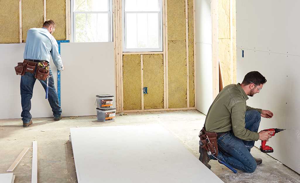 Experienced drywall contractor at work