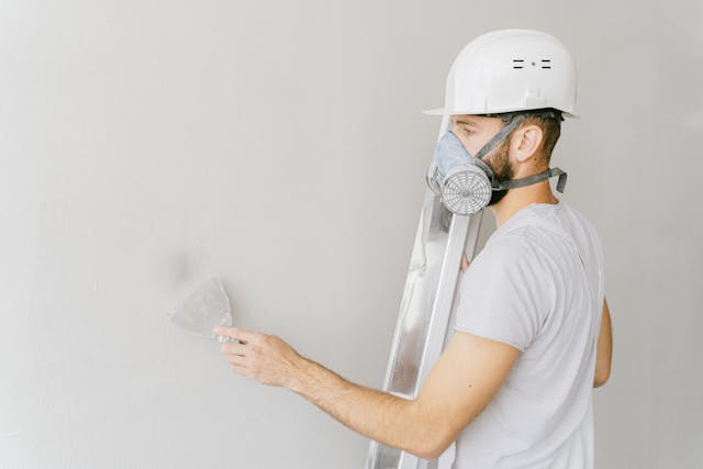 Experienced drywall contractor at work